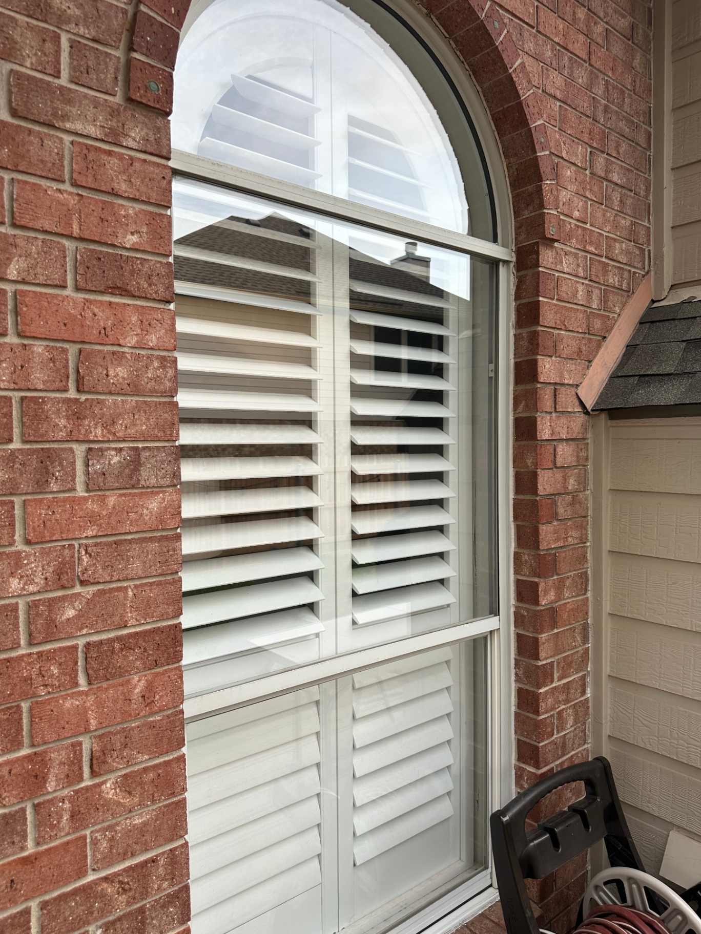 Arched window with shutters, freshly cleaned