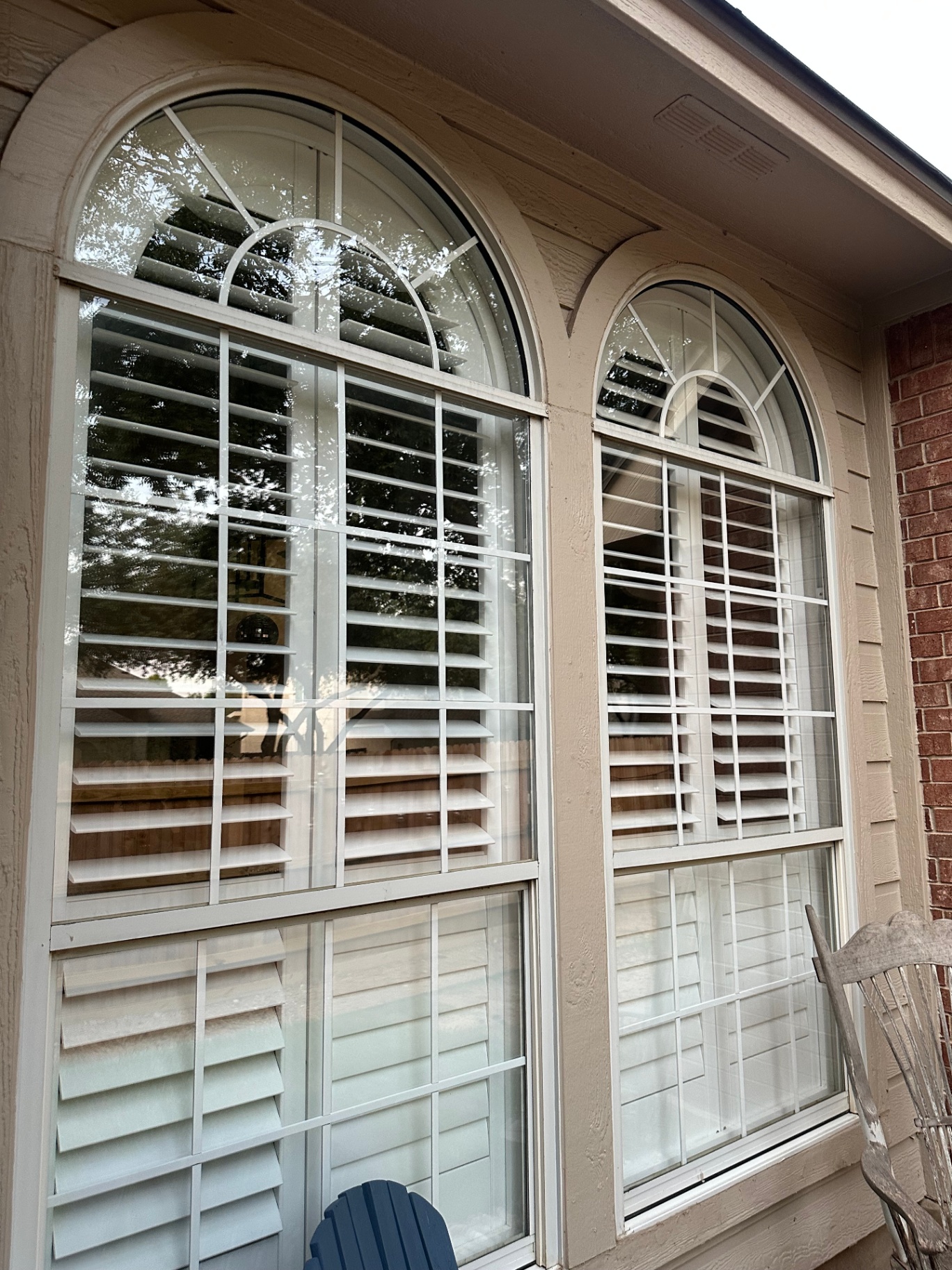 Tall arched windows on Austin home after cleaning